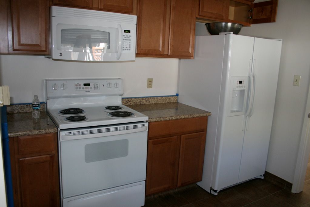 Kitchen Before - Stove & Fridge