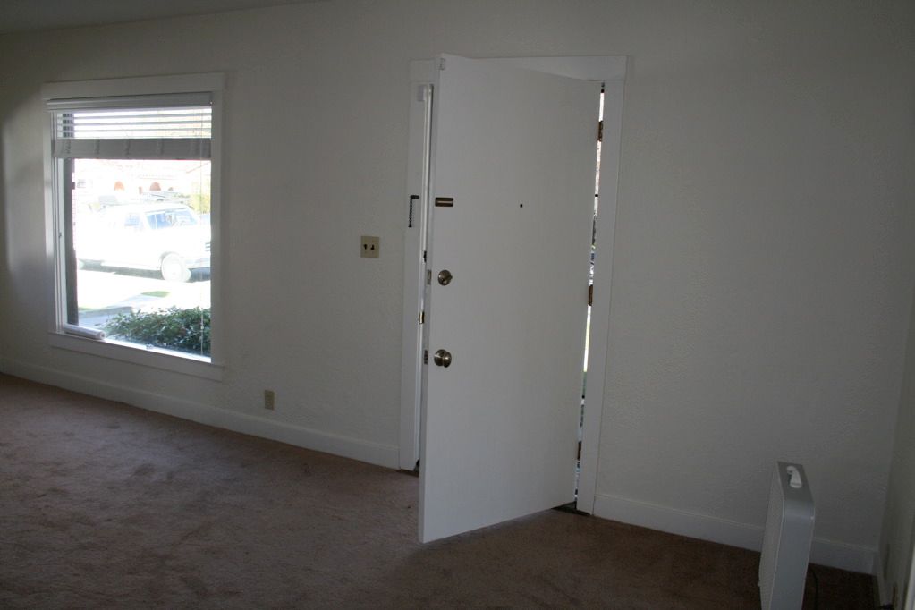 Living Room Before - Looking towards Front Door