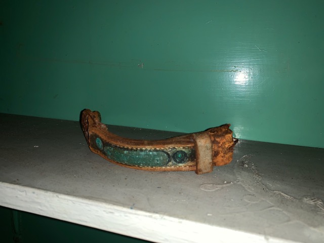 What appears to be a piece of an old dog collar