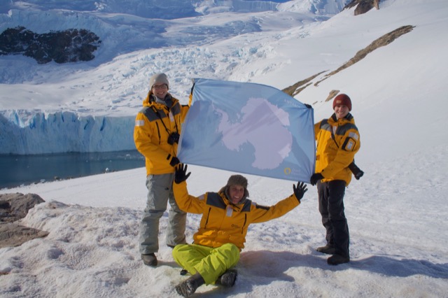 James, Myke, and Jeremy with the Antarctic Flag
