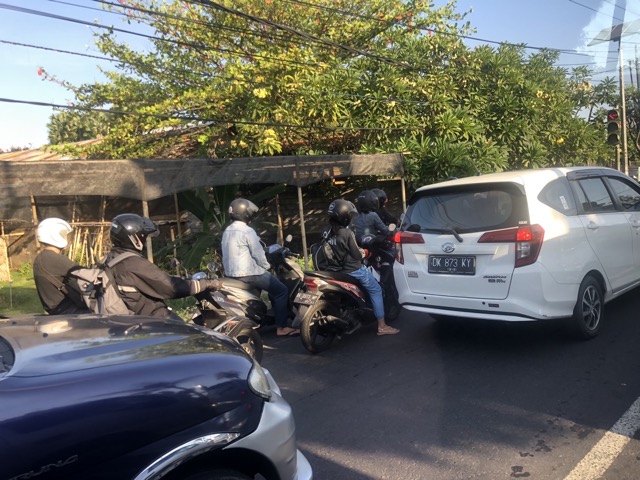 Motorbikes in traffic jam