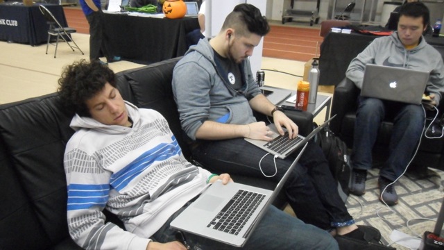 David Steinberg takes a quick nap while students work next to him, tiredlessly