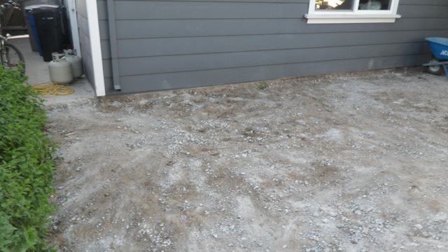 After: Cleared concrete by garage