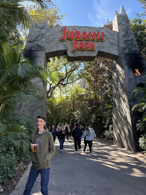 Joe at the entrance to Jurassic Park