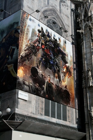 Transformers advertisement covering up construction at Duomo