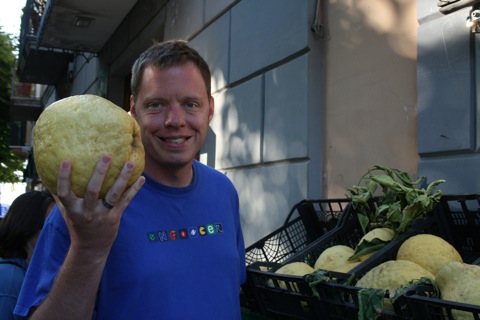 Rob holding a giant fruit that looks like a lemon