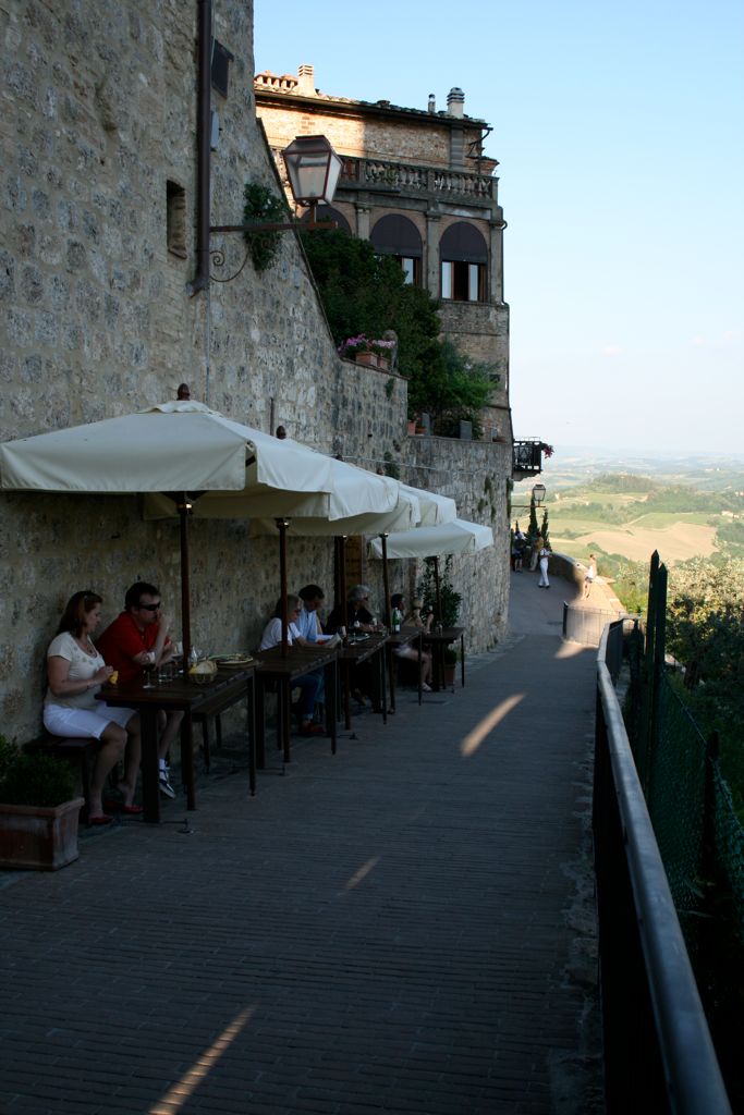 People drinking wine and overlooking the valley