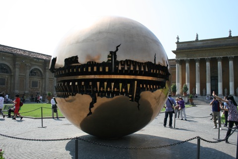 Giant gold ball in the middle of the courtyard called 