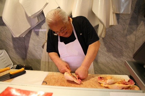 Butcher preparing the chicken for our cooking class