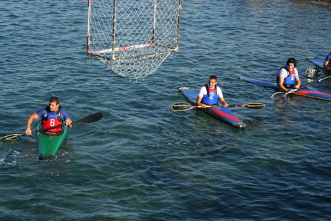 Guys lined up below the net