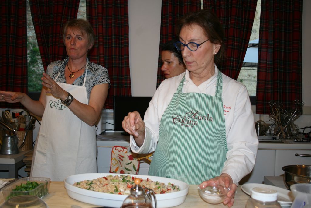 Putting the finishing touches on the Panzanella