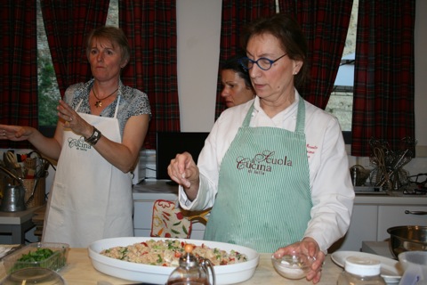 Putting the finishing touches on the Panzanella