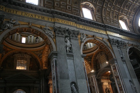 Gold mosaic lettering around the top of the entire room