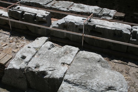 Marble seats with senator's names engraved into them