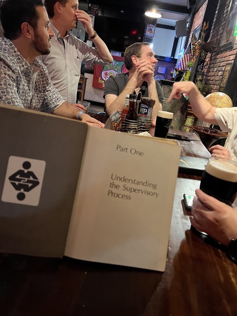 Reading a book with dinner