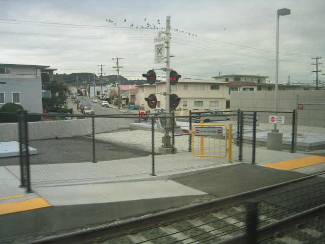 OK, now this is just stupid.  They have this big pole and teeny little arm which is just big enough so you can't squeeze around it to prevent you from going across the tracks, but then there is a gate which is wide open right next to it!*?