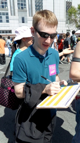 David signing up for marriage equality at the HRC booth