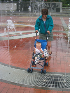 Suzy and Theo running through the Centenniel fountain