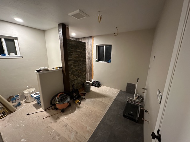 Our bathroom coming together with the tile in the shower and some of the tile floor