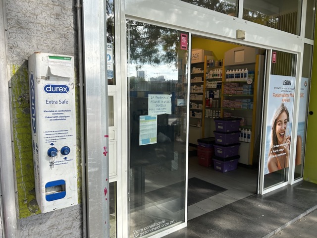 24-hour condom dispenser outside the pharmacy