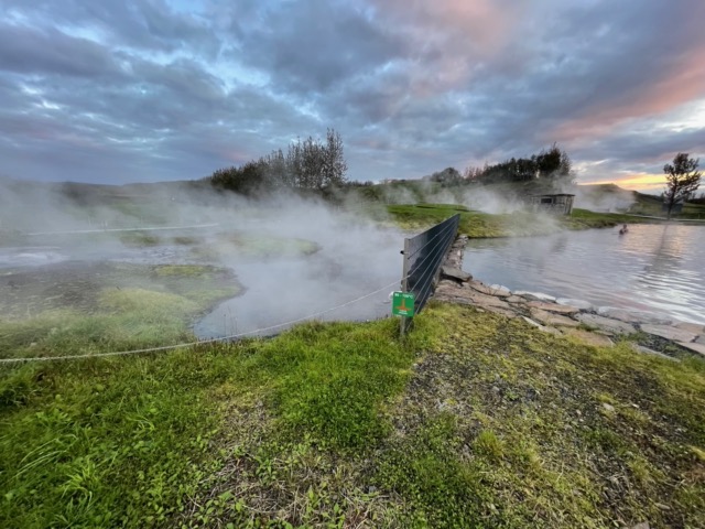 Natural hot springs and geyser (left) feeding the Secret Lagoon (right, that we swam in)